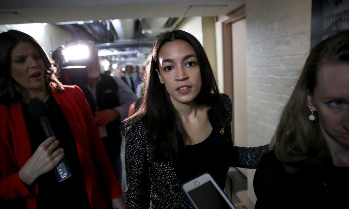 Rep. Alexandria Ocasio-Cortez (D-N.Y.) answers questions from reporters as she leaves a House Democratic caucus meeting in Washington on May 22, 2019. (Win McNamee/Getty Images)