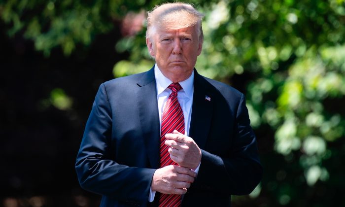 President Donald Trump walks out of the Oval Office to speak with reporters at the White House on June 11, 2019. (Jim Watson/AFP/Getty Images)