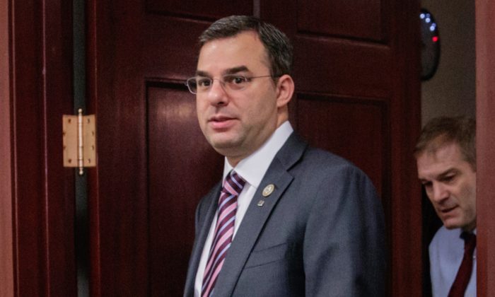 Rep. Justin Amash, R-Mich., followed by Rep. Jim Jordan, R-Ohio, leaving a closed-door strategy session on March 28, 2017. (J. Scott Applewhite/AP Photo)