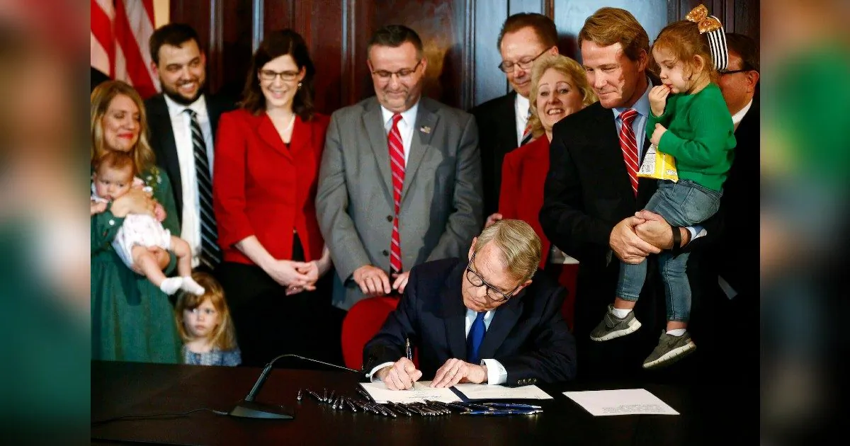 Gov. Mike DeWine signs a bill that prohibits aborting an unborn child with a detectable heartbeat in Columbus, OH. (Fred Squillante/The Columbus Dispatch via AP, File)