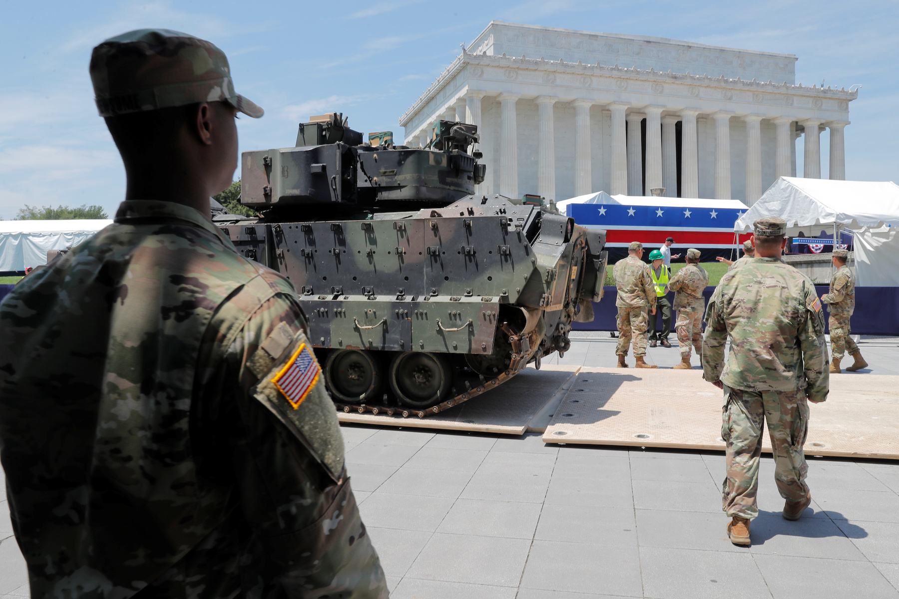 A Bradley Fighting Vehicle is moved into place as July Fourth preparations continue at Lincoln Memorial in Washington
