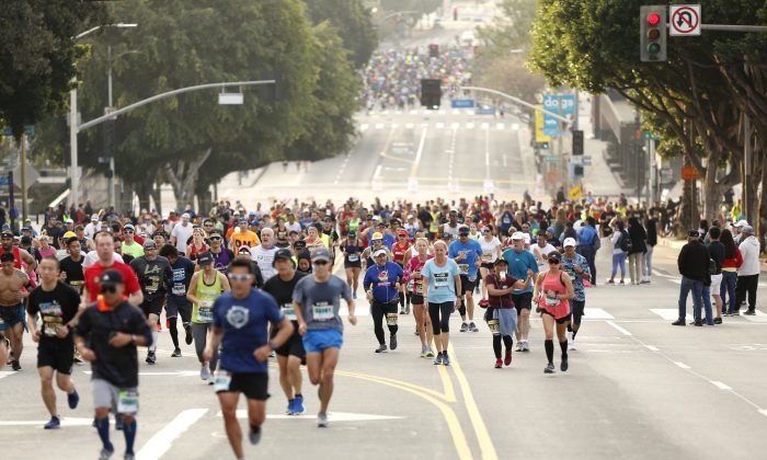 Runners climb 1st Street during the 2019 Skechers Performance Los Angeles Marathonon in Los Angeles, California on March 24, 2019. (Photo by Katharine Lotze/Getty Images)