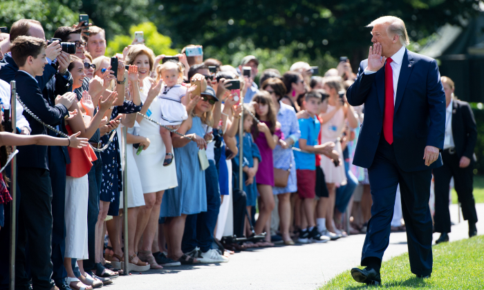 President Donald Trump greets guests prior to departing on Marine One from the South Lawn of the White House in Washington on July 5, 2019. (Saul Loeb/AFP/Getty Images)