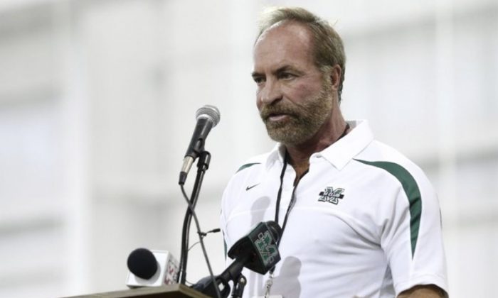 In this Sept. 6, 2014 photo, Chris Cline speaks as Marshall University dedicates the new indoor practice facility as the Chris Cline Athletic Complex in Huntington, W.Va.  (Sholten Singer/The Herald-Dispatch via AP)