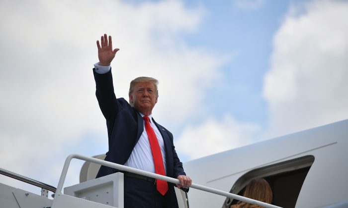 President Donald Trump waves as he boards Air Force One at Joint Base Andrews in Maryland on July 5, 2019. (Mandel Ngan/AFP/Getty Images)