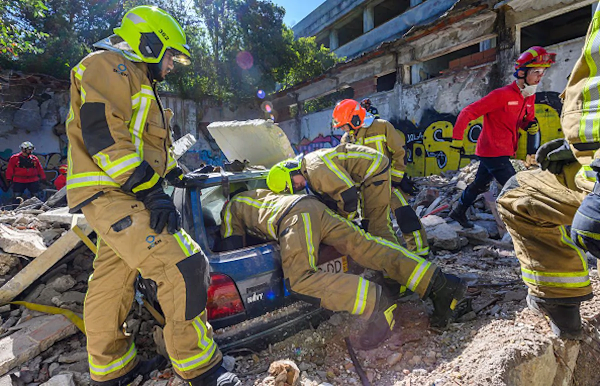 Portuguese firefighters from Cascais Municipality rescue "victims" trapped inside cars during a CASCADE-19 EU civil protection exercise simulated earthquake related event staged at an abandoned building in Alcabideche, Portugal on May 31, 2019. (Horacio Villalobos, Corbis/Corbis via Getty Images)