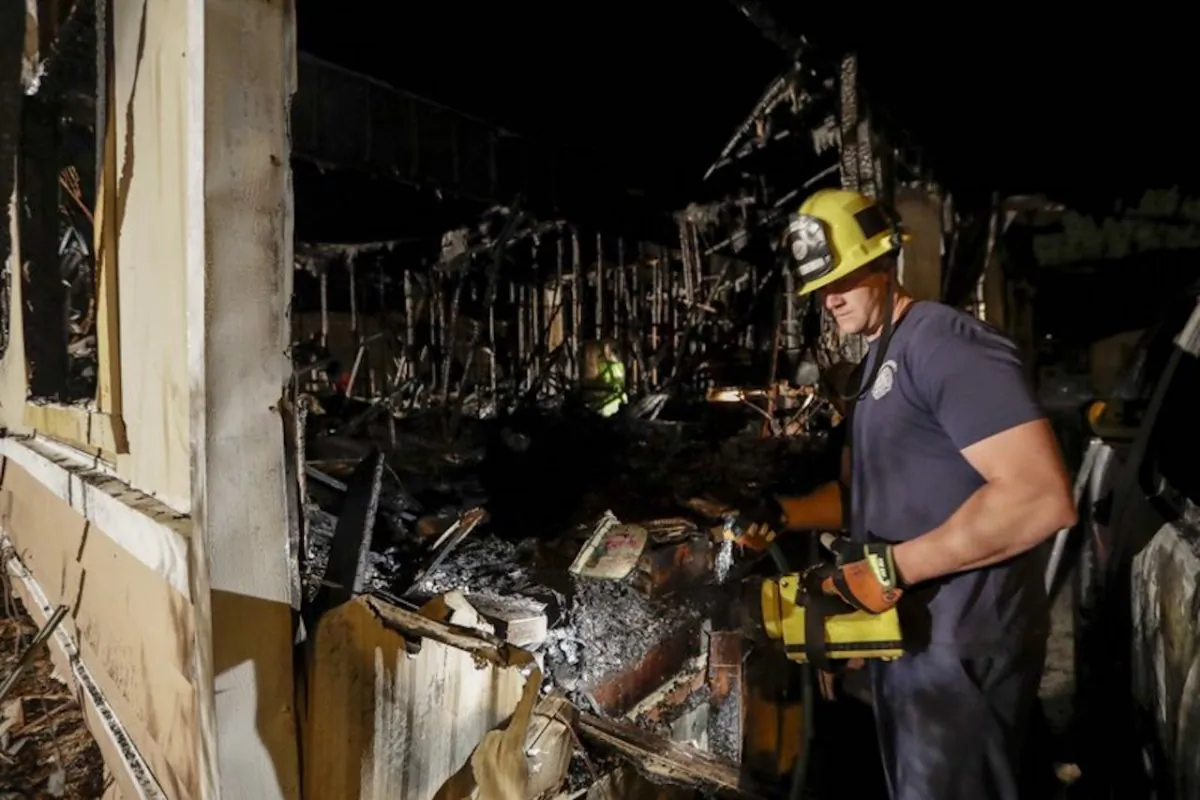 A fireman looks over a home that burned after an earthquake in Ridgecrest, Calif., on July 6, 2019. (Marcio Jose Sanchez/AP Photo)