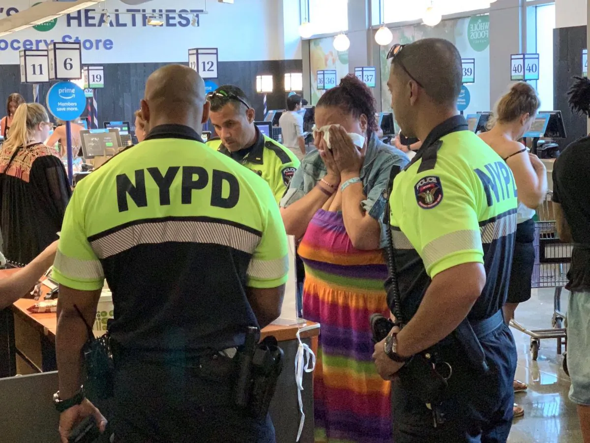 NYPD police officers did not arrest a woman who was accused of shoplifting food, but instead paid for the food at a Union Square Whole Foods store in New York, on July 4, 2019. (Paul Bozymowski @pboz/Twitter)