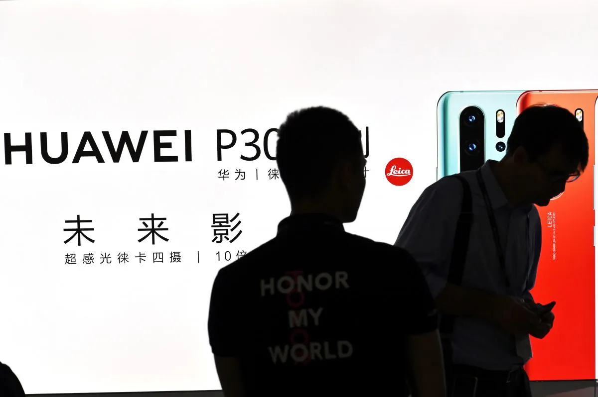 People visit a Huawei stand during the Mobile World Congress at the Shanghai New International Expo Centre in Shanghai on June 26, 2019. (Hector Retamal/AFP/Getty Images)