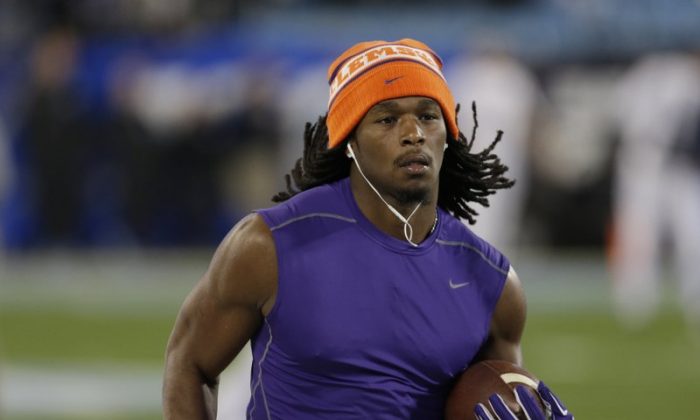 File photo showing Tyshon Dye warming up prior to the Atlantic Coast Conference championship NCAA college football game against North Carolina in Charlotte, N.C. Dye, a former Clemson and East Carolina running back, drowned after swimming in a lake during a family outing on July 5, 2019. (Bob Leverone/AP)
