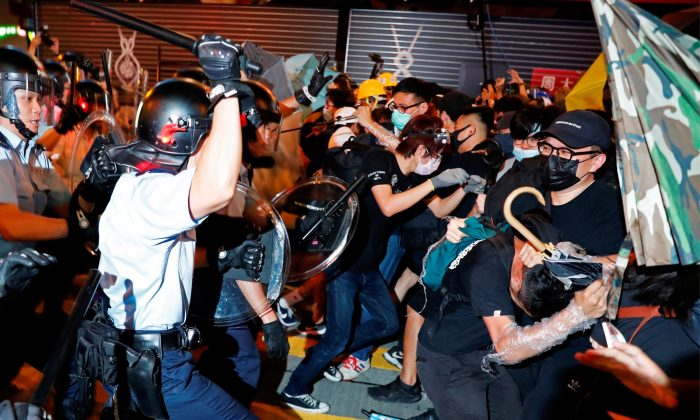 Riot police disperse anti-extradition bill protesters after a march at Hong Kong’s tourism district Nathan Road near Mongkok, China on July 7, 2019. (Tyrone Siu/Reuters)