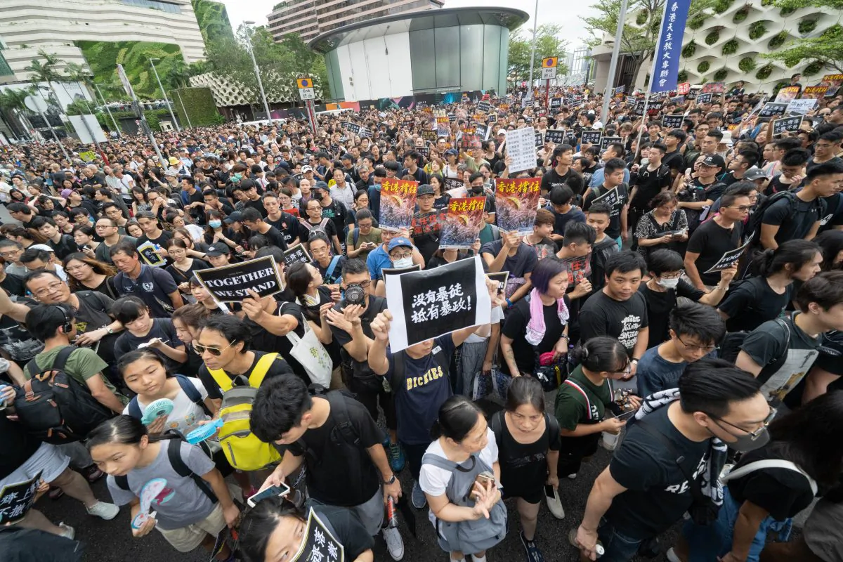 Protesters gather to take part in a march to the West Kowloon railway station against a proposed extradition bill in Hong Kong on July 7, 2019. (Li Yi/Epoch Times)