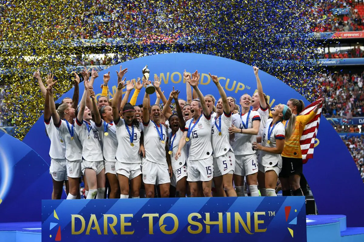 USA's players celebrate with the trophy after the France 2019 Womens World Cup football final match between USA and the Netherlands, on July 7, 2019, at the Lyon Stadium in Lyon, central-eastern France. (FRANCK FIFE/AFP/Getty Images)