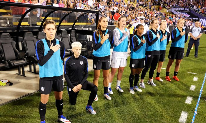 Megan Rapinoe #15 of the U.S. Women's National Team kneels during the playing of the U.S. National Anthem before a match against Thailand at MAPFRE Stadium in Columbus, Ohio, on September 15, 2016. (Jamie Sabau/Getty Images)