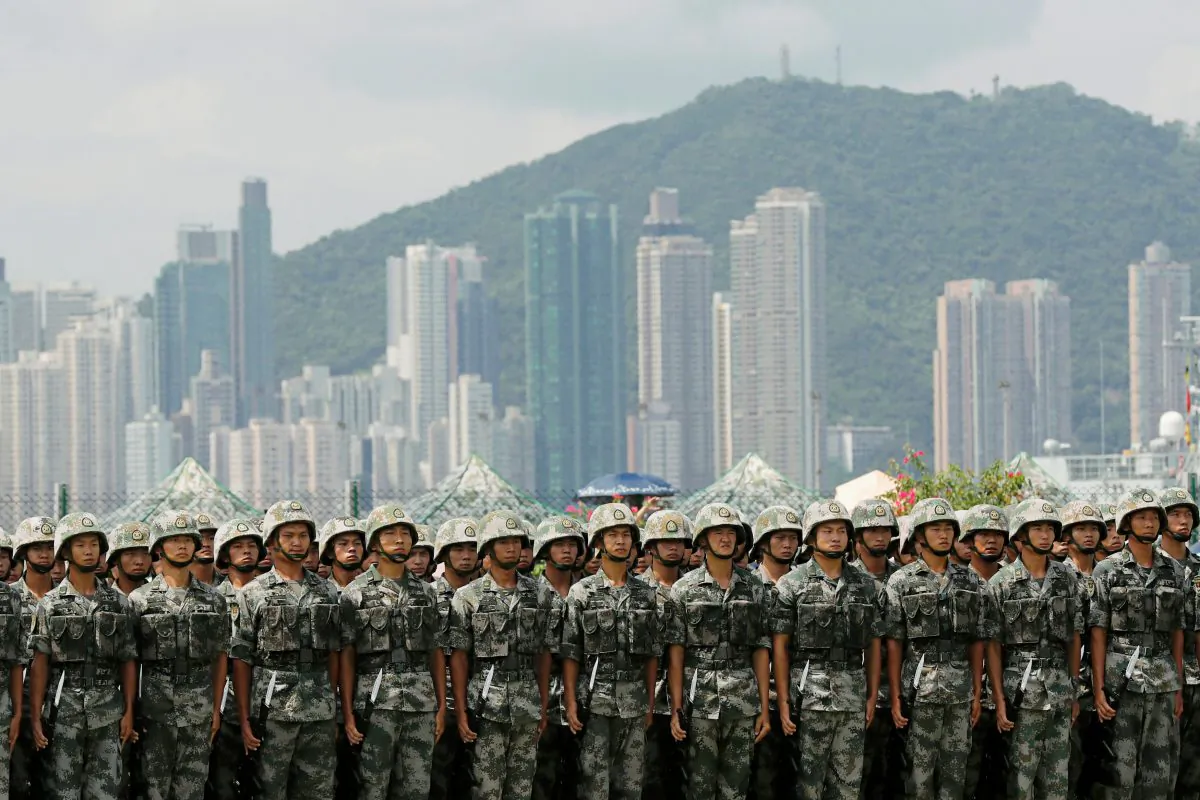 The People's Liberation Army (PLA) soldiers take part in a performance during an open day of Stonecutters Island naval base, in Hong Kong, China on June 30, 2019. (Tyrone Siu/Reuters)