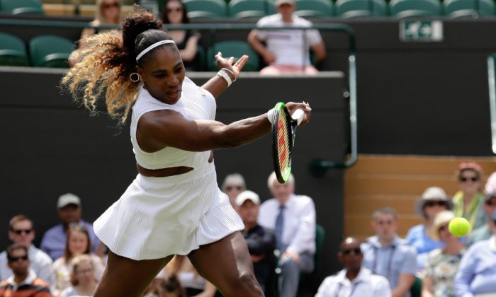 United States' Serena Williams returns the ball to Spain's Carla Suarez Navarro in a women's singles match during day seven of the Wimbledon Tennis Championships in London on July 8, 2019. (Kirsty Wigglesworth/Photo/AP)