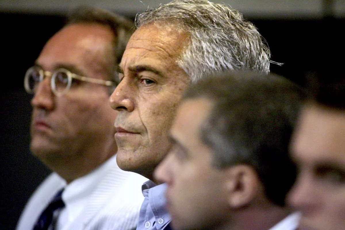 Jeffrey Epstein, center, appears in court in West Palm Beach, Fla. on July 30, 2008. (Uma Sanghvi/Palm Beach Post via AP, File)