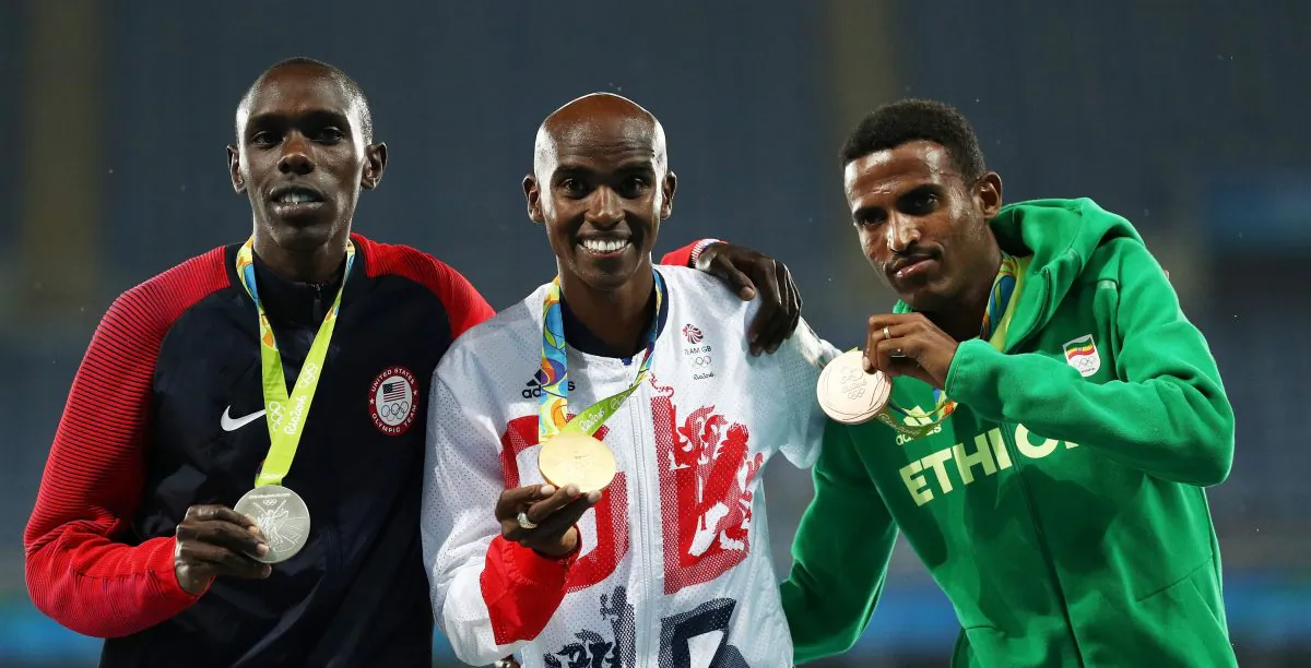Silver medalist Paul Kipkemoi Chelimo of the United States, gold medalist Mohamed Farah of Great Britain and bronze medalist Hagos Gebrhiwet of Ethiopia stand on the podium during the medal ceremony for the Men's 5000 meter on Day 15 of the Rio 2016 Olympic Games at the Olympic Stadium on August 20, 2016 in Rio de Janeiro, Brazil.  (Photo by Patrick Smith/Getty Images)