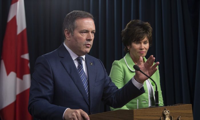 Alberta Premier Jason Kenney and Energy Minister Sonya Savage respond to the federal approval of the Trans Mountain Pipeline in Edmonton, Alberta, on June 18, 2019. (Amber Bracken/The Canadian Press)