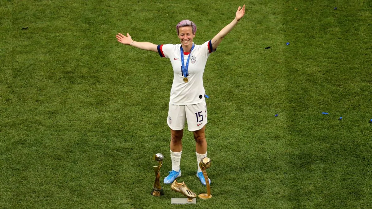Megan Rapinoe of the USA celebrates with the FIFA Women's World Cup Trophy, the Golden Boot and The Golden Ball following the 2019 FIFA Women's World Cup France Final match between The United States of America and The Netherlands at Stade de Lyon in Lyon, France on July 07, 2019. (Robert Cianflone/Getty Images)