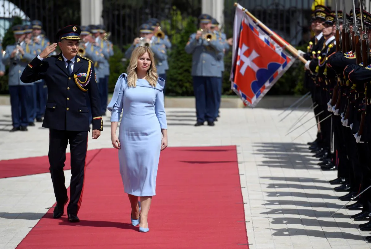 Slovakia's President Zuzana Caputova reviews the guard of honor at the Presidential Palace after her swearing-in ceremony in Bratislava, Slovakia, on June 15, 2019. (Radovan Stoklasa/Reuters)