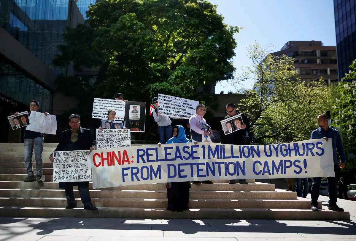 People hold signs protesting China's treatment of the Uyghur people, in Vancouver, British Columbia, Canada, May 8, 2019. (Lindsey Wasson/Reuters)