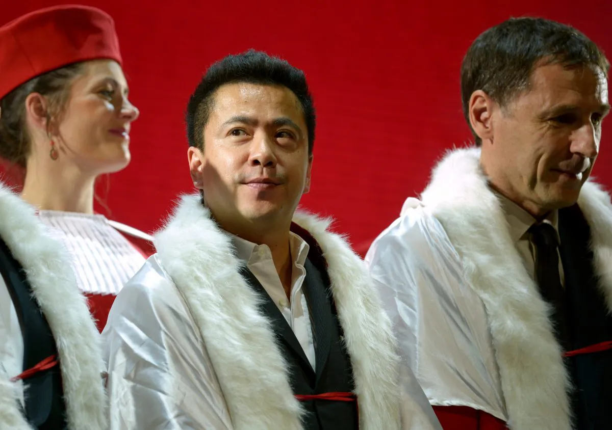 President of the Huayi Brothers Media Group Wang Zhonglei (C) attends the inauguration "Jurade of Saint-Emilion's" first chapter in Beijing on May 31, 2014. (Wang Zhao/AFP/Getty Images)