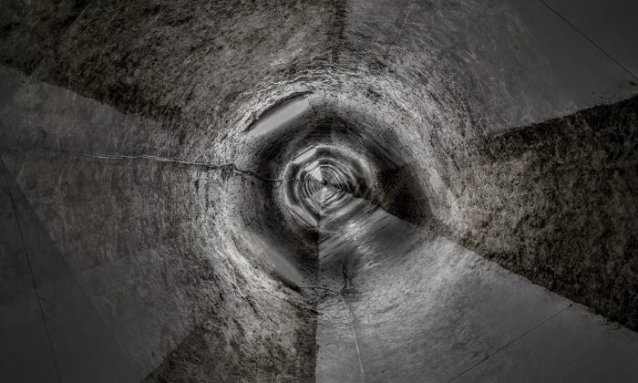 A manhole in a stock photo. (gdtography/Unsplash)