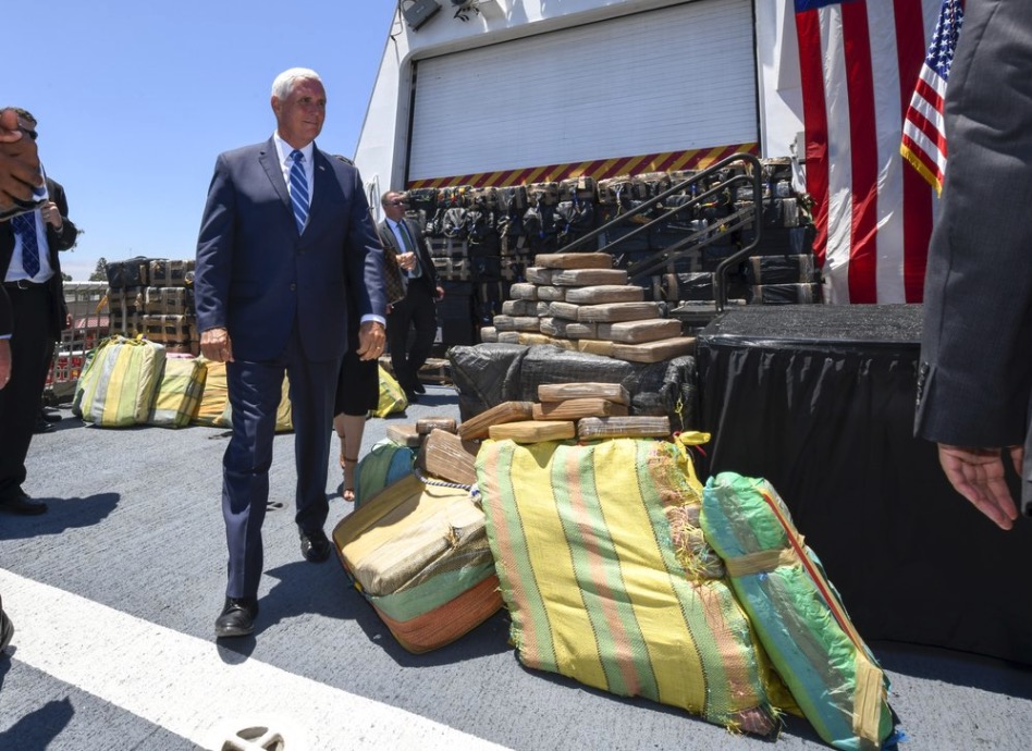 Pence stands beside seized drugs