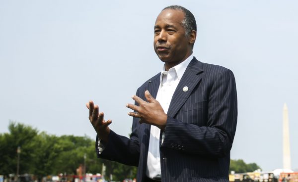 Secretary of Housing and Urban Development Ben Carson answers questions from the press after delivering remarks at the Innovative Housing Showcase on the National Mall in Washington