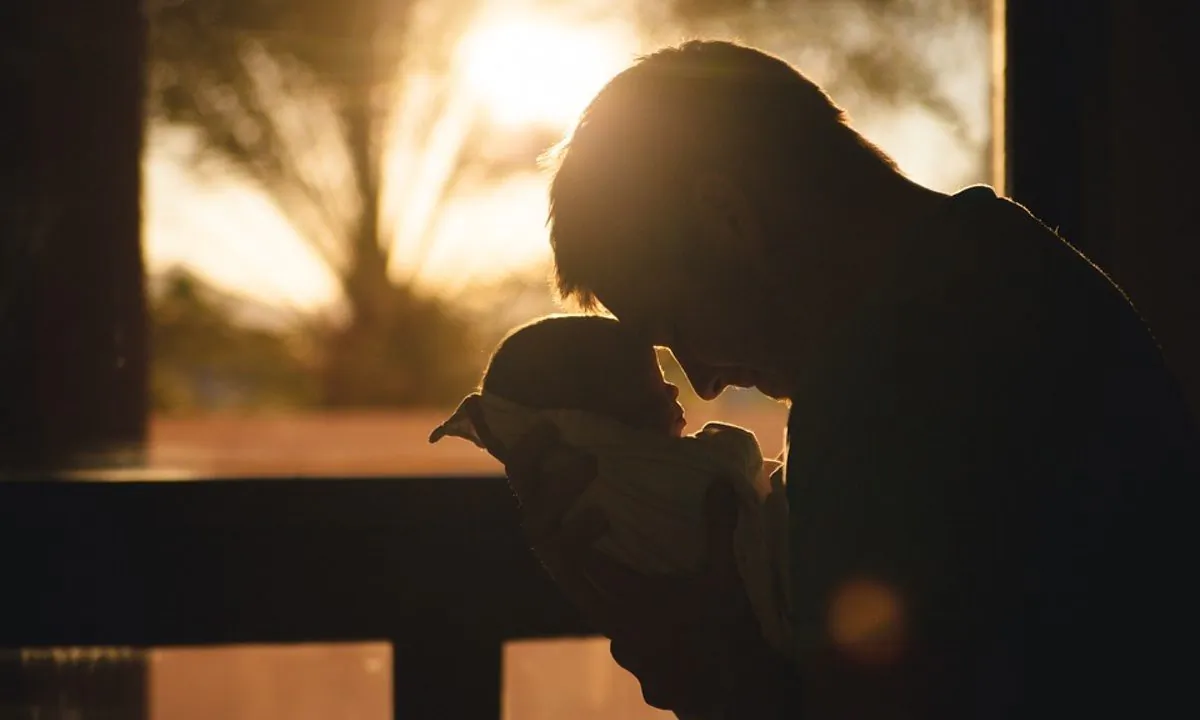 Stock image of a baby and father. (StockSnap/Pixabay)