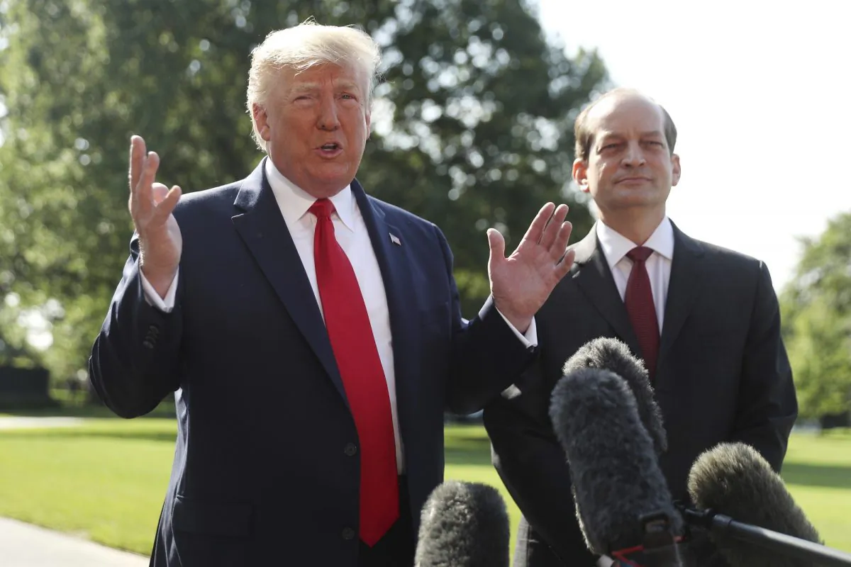 President Donald Trump speaks to members of the media with Secretary of Labor Alex Acosta on the South Lawn of the White House, on July 12, 2019. (Andrew Harnik/AP Photo)
