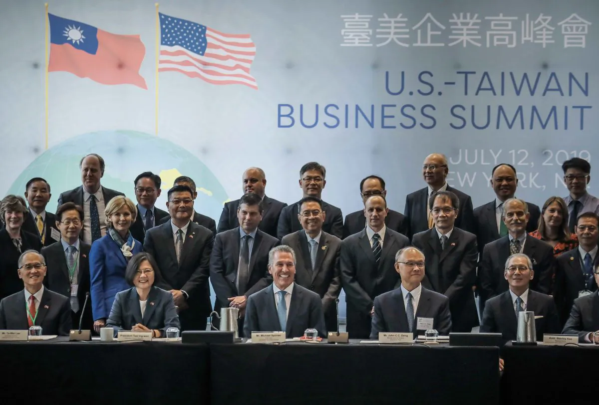 Taiwan President Tsai Ing-we, seated second from left, pose with participants at the U.S. Taiwan Business Summit in New York on July 12, 2019. (AP Photo/Bebeto Matthews)