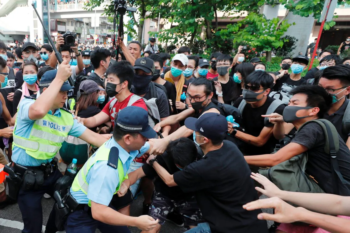Police try to disperse pro-democracy activists after a march at Sheung Shui, a city border town in Hong Kong, China on July 13, 2019. (Tyrone Siu/Reuters)