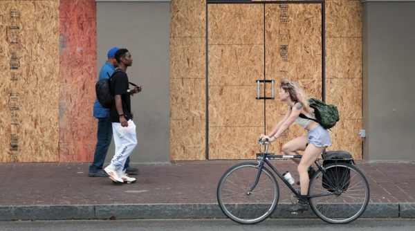 A storefront on the edge of the French Quarter is boarded up to prevent damage