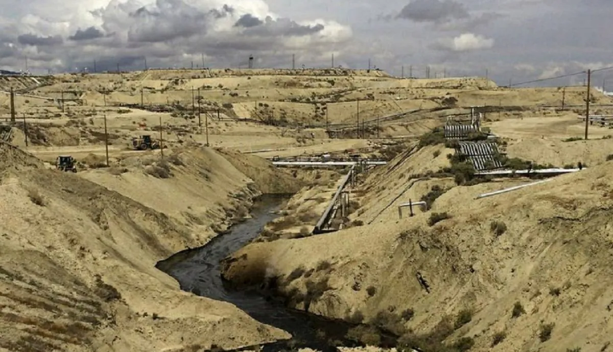 Oil flows at a Chevron oil field in Kern County, Calif. Nearly 800,000 gallons of oil and water has seeped from the ground since May. (California Deptartment of Fish and Wildlife's Office of Spill Prevention and Response via AP)