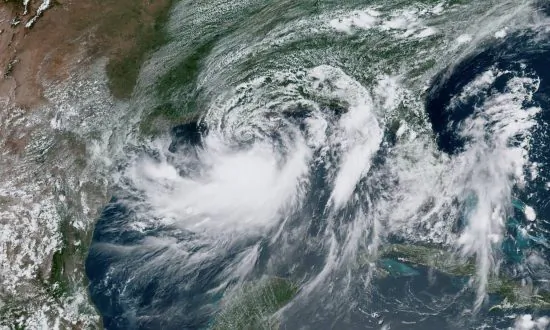 Weakened Barry Rolls Into Louisiana, Drenches Gulf Coast
