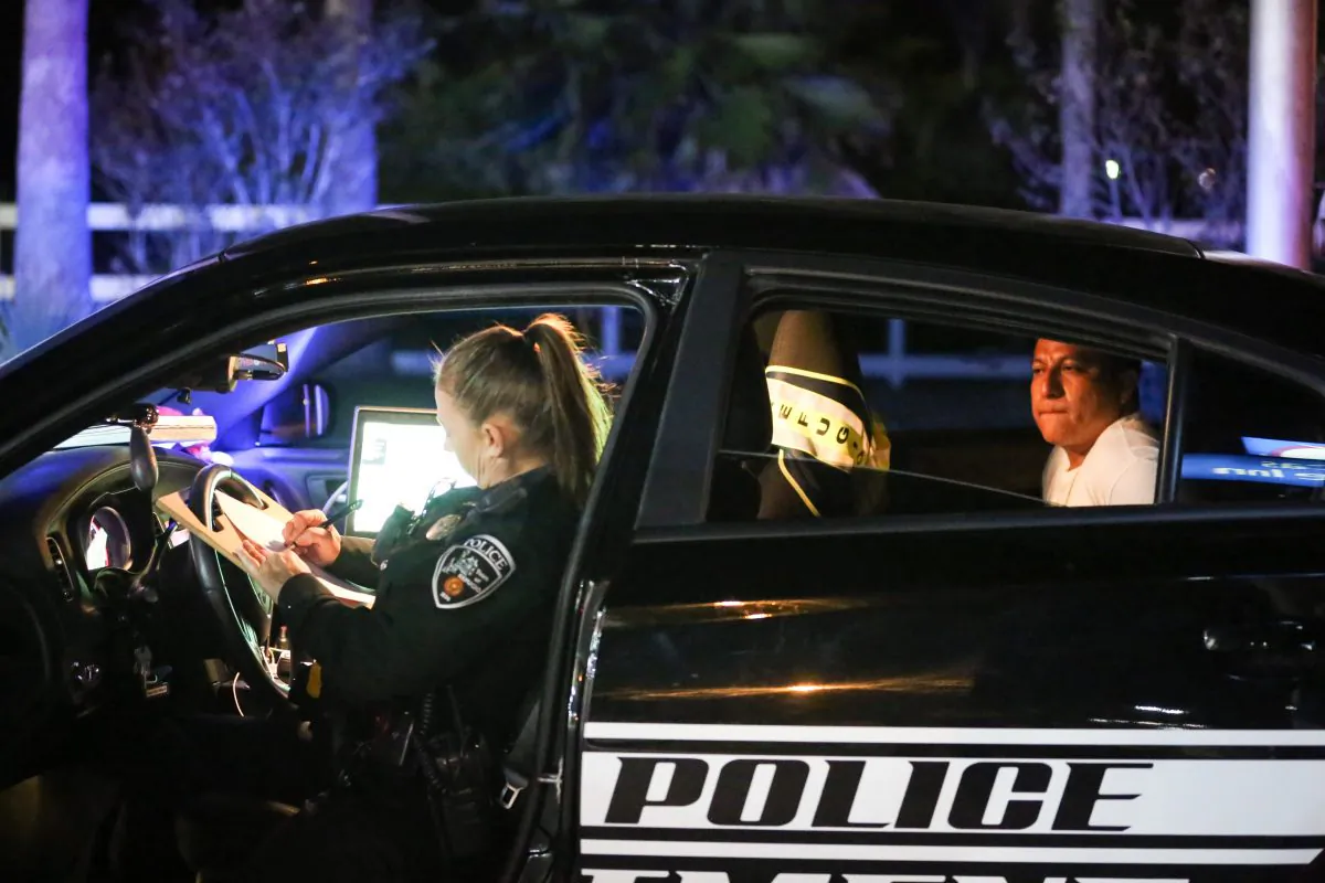 Refugio City Police Officer Tammy Gregory arrests alleged illegal immigrant Jose Carrasco Leon in Refugio County, Texas, on Nov. 10, 2018. (Samira Bouaou/The Epoch Times)
