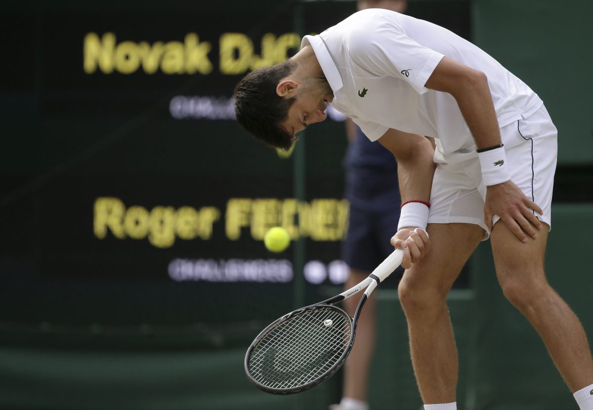 SwitBritain Wimbledon Tenniszerland's Roger Federer returns the ball to Serbia's Novak Djokovic during the men's singles final match of the Wimbledon Tennis Championships in London, Sunday, July 14, 2019. (AP Photo/Tim Ireland)