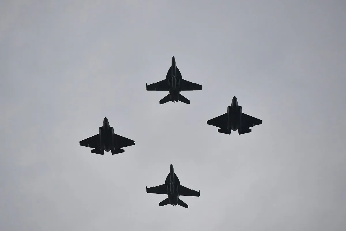 Two F-35s (L and R) and two F-18s fly overhead during the "Salute to America" Fourth of July event at the Lincoln Memorial in Washington on July 4, 2019. Rare earths are needed for the permanent magnets used in these fighter jets. (MANDEL NGAN/AFP/Getty Images)