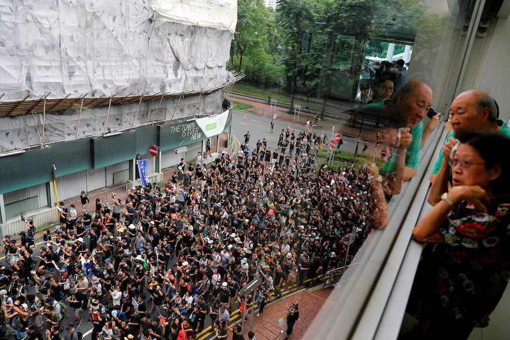 Protesters march at Sha Tin District of East New Territories, Hong Kong on July 14, 2019. (Tyrone Siu/Reuters)