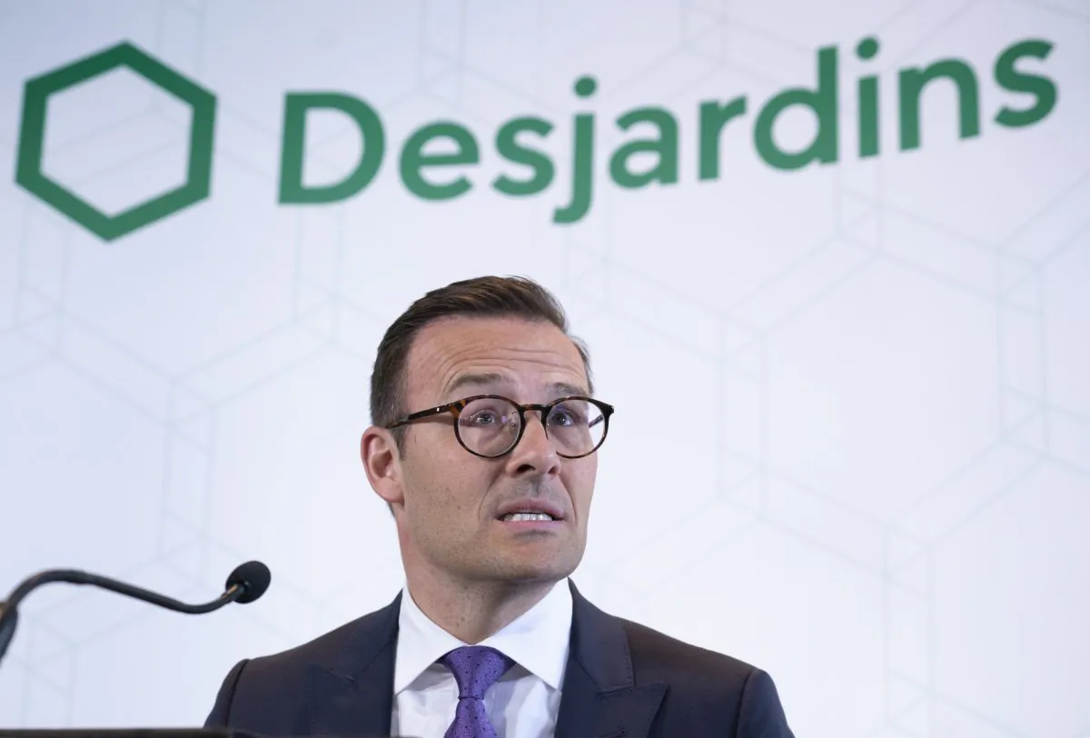 Desjardins President and CEO Guy Cormier reads a statement during a news conference in Montreal on June 20, 2019. (Paul Chiasson/The Canadian Press)