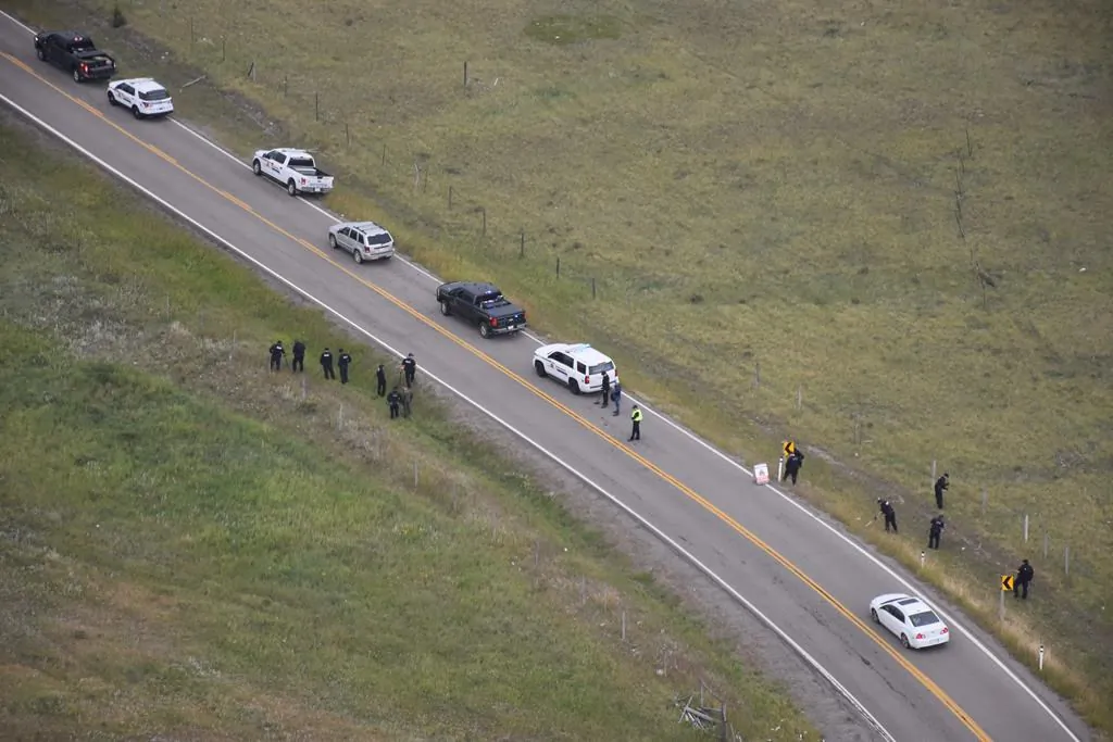 Police investigate the scene of a shooting along Highway 1A near Morley, AB., in this August 2018 police handout photo. (HO/The Canadian Press)