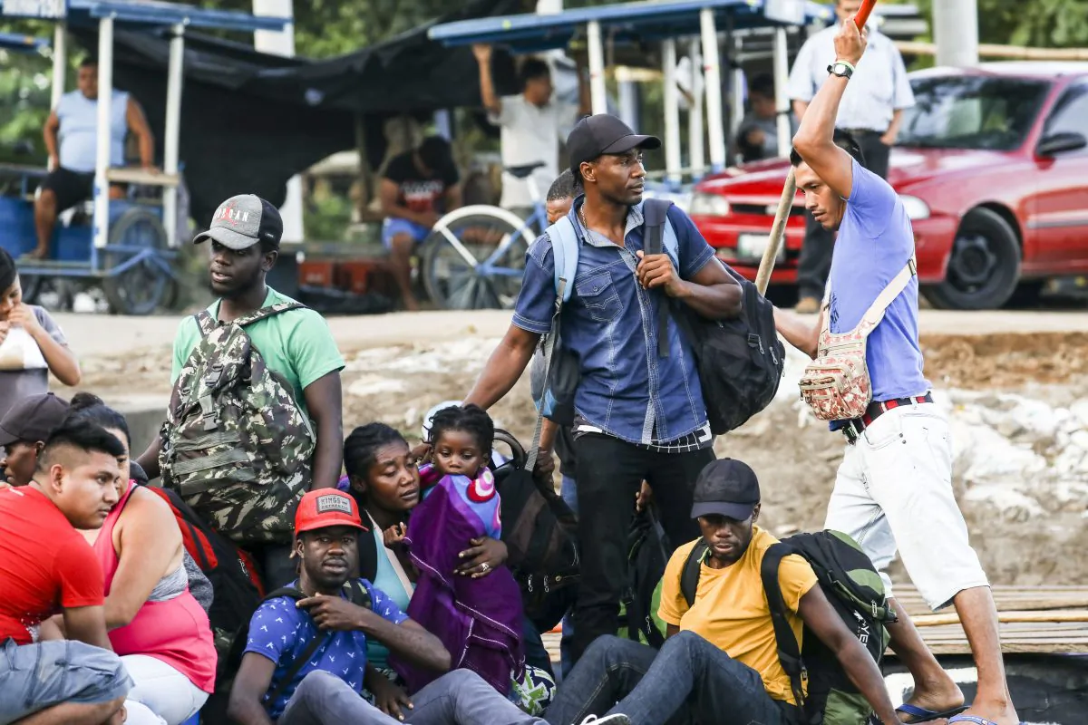 A group of 10 Haitians illegally cross the Suchiate River on a tube raft from Tecun Uman, Guatemala, to Hidalgo City, Mexico, on June 28, 2019. Many traveled through Colombia, Panama, Costa Rica, Nicaragua, and Honduras to get this far. (Charlotte Cuthbertson/The Epoch Times)