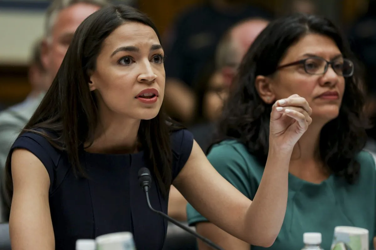 Reps Alexandria Ocasio-Cortez (L) and Rashida Tlaib at a House hearing in front of the Committee on Oversight and Reform, in Washington on July 12, 2019. (Charlotte Cuthbertson/The Epoch Times)