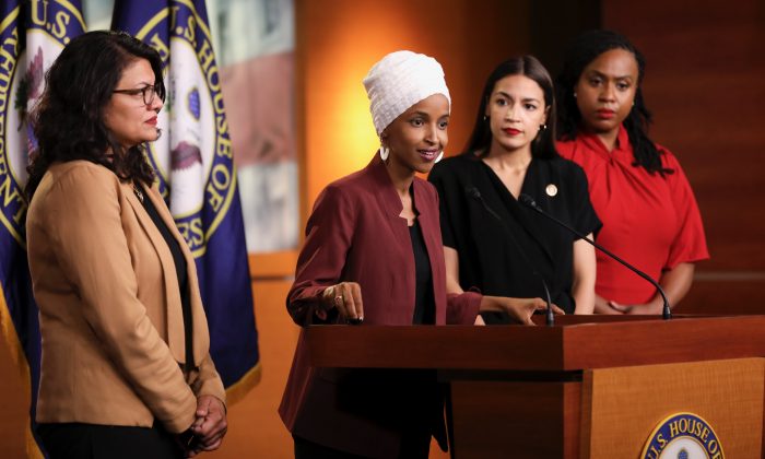 Reps. Alexandria Ocasio-Cortez (D-N.Y.), Ilhan Omar (D-Minn.), Ayanna Pressley (D-Mass.), and Rashida Tlaib (D-Mich.) speak at a press conference at the U.S. Capitol on July 15, 2019. (Holly Kellum/NTD)