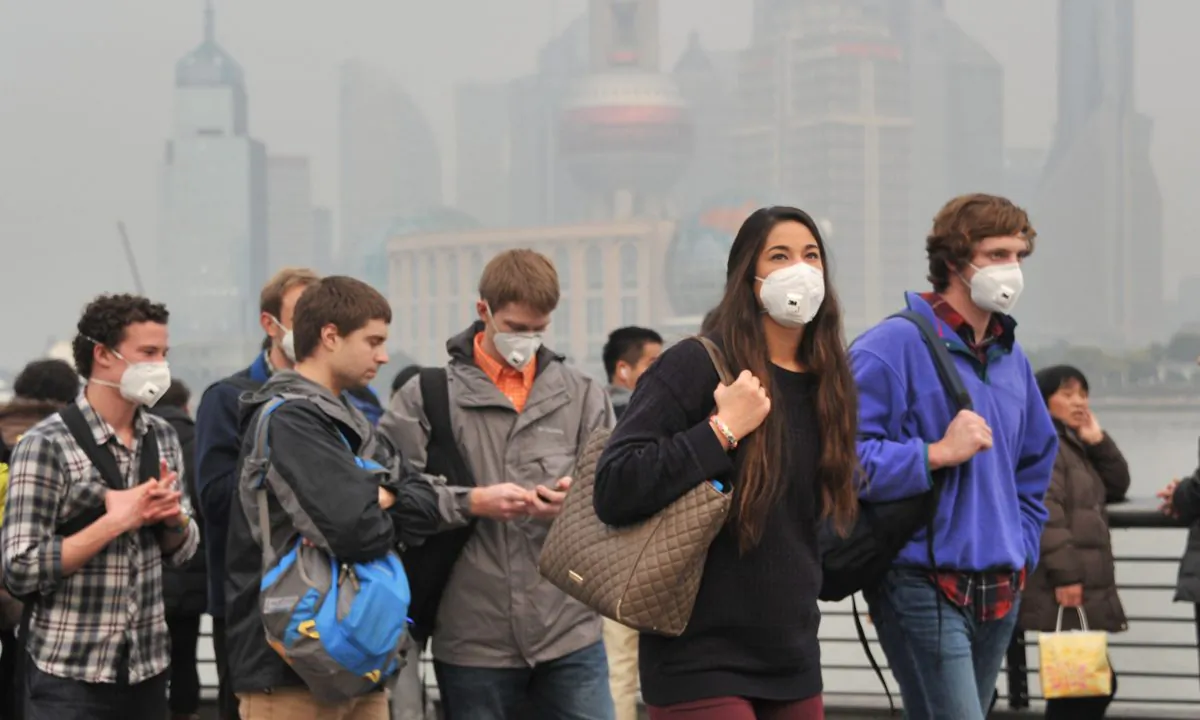 Tourists in Shanghai, China wearing masks due to pollution. (VCG/VCG via Getty Images)
