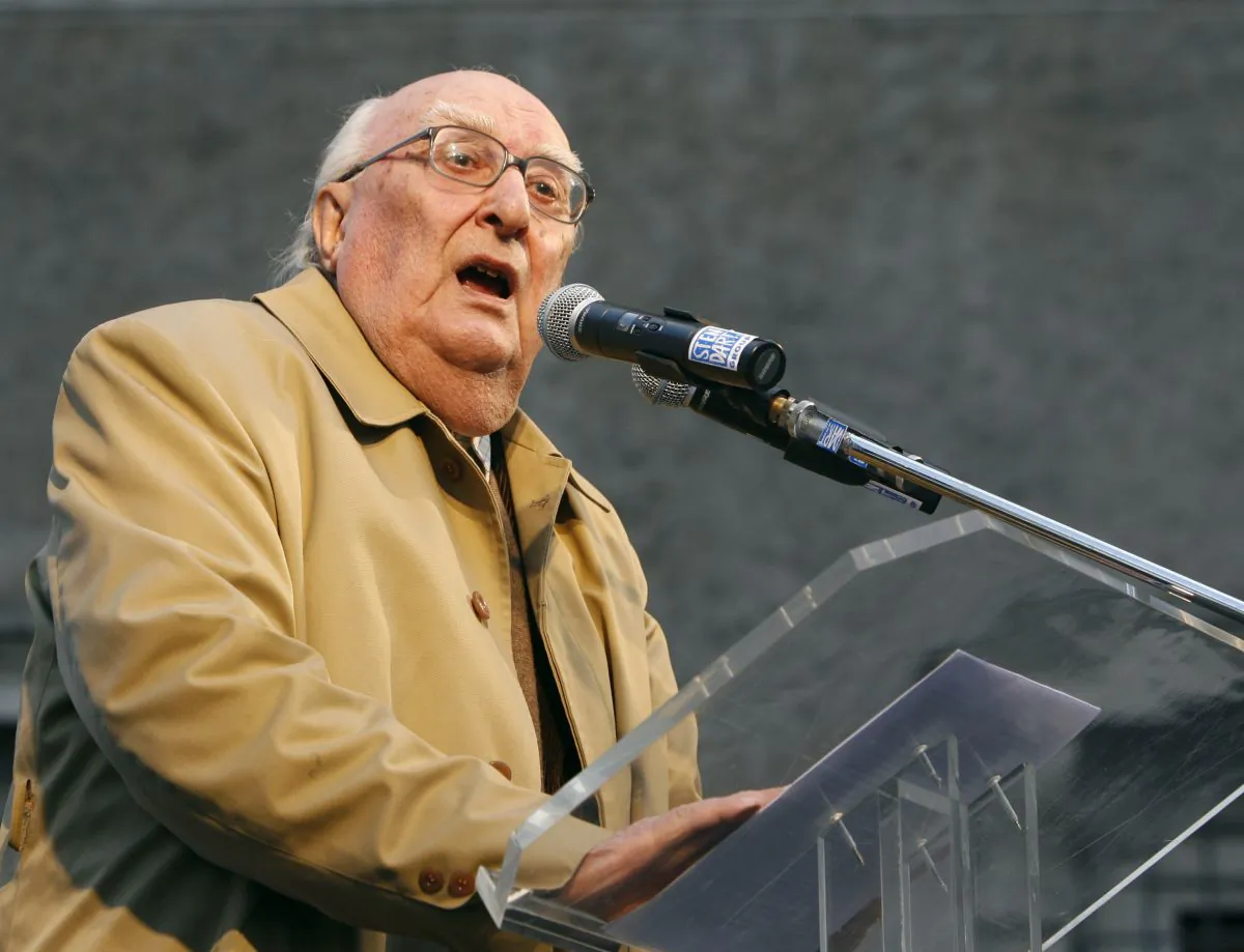 Italian author Andrea Camilleri makes his point during a demonstration against the Vatican's influence on the ongoing right-to-die debate, in Rome on Feb. 21, 2009. (Alessandra Tarantino/File Photo via AP)
