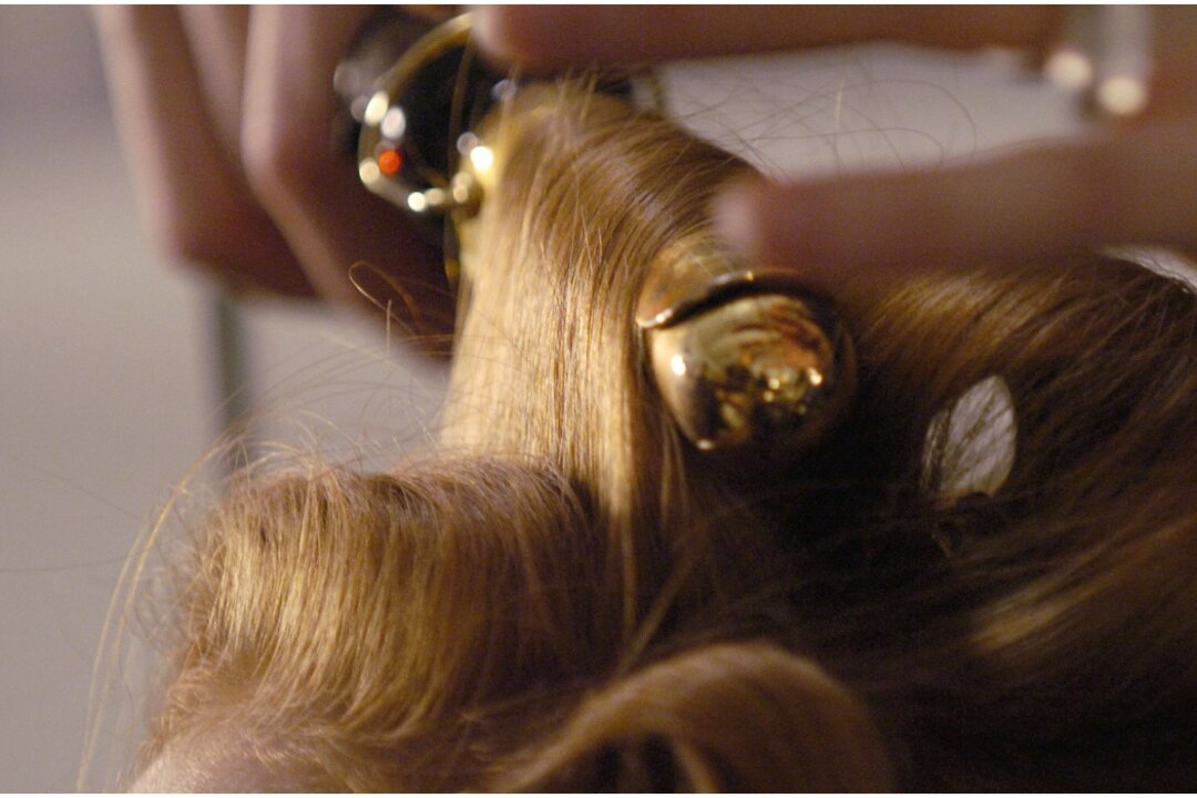 Hair being curled for a New York fashion show in a file photo. (Stan Honda/AFP/Getty Images)
