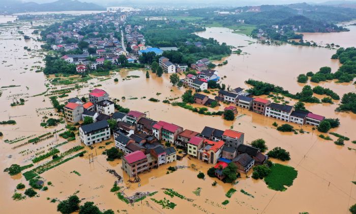 Buildings are submerged after heavy rain caused flooding in Hengyang in central China's Hunan province on July 9, 2019. (STR/AFP/Getty Images)
